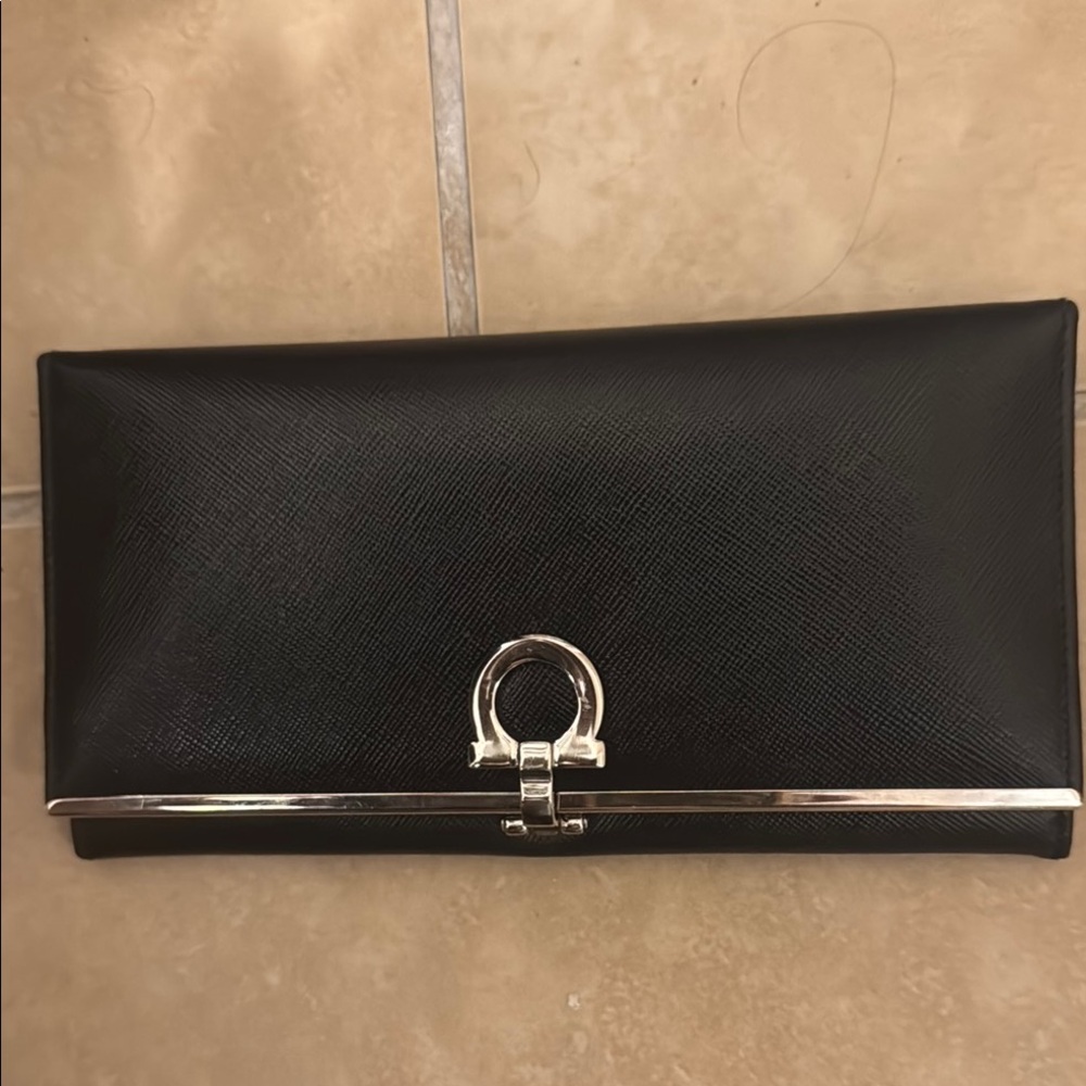 Salvatore Ferragamo Elegant Black and Silver Clutch/Wallet with Gold Clasp